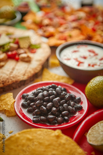 Wallpaper Mural Close up on black beans with various freshly made Mexican foods assortment Torontodigital.ca