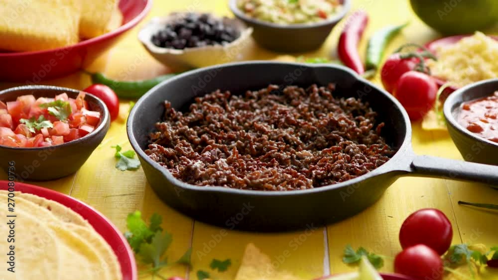 Various fresh and tasty ingredients for chilli con carne. With meat on iron pan Various fresh and tasty ingredients for chilli con carne. With meat on iron pan