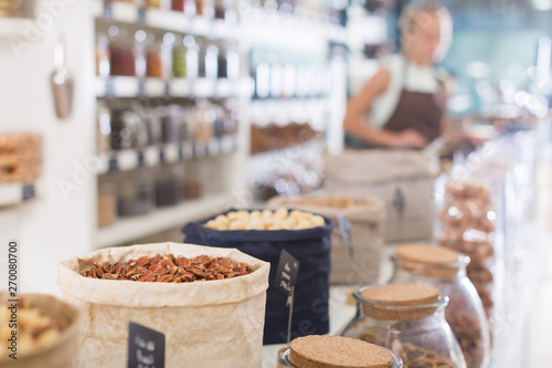 Illustration of showcase with dried fruits and nuts in bag