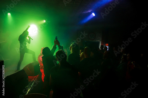 Crowd at concert  in rock club © Mynameislisenok
