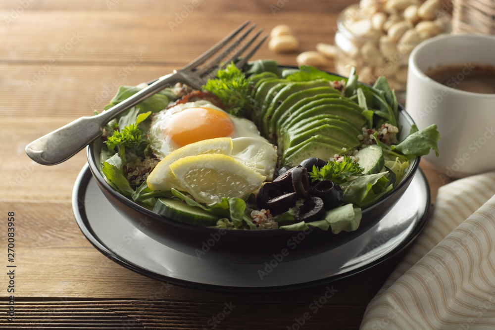 Healthy food. Eggs, quinoa, avocado, green salad, black olives. Wooden table. diet, lose weight. Healthy food. Eggs, quinoa, avocado, green salad, black olives. Wooden table. diet, lose weight.