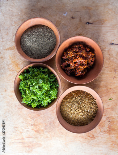 Spices in the bowls closeup on table