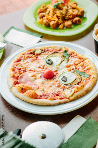 Funny face pizza for kids in a restaurant.