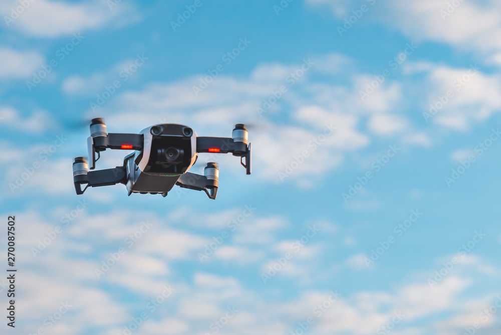 drone close up in sky. white clouds on background drone close up in sky. white clouds on background