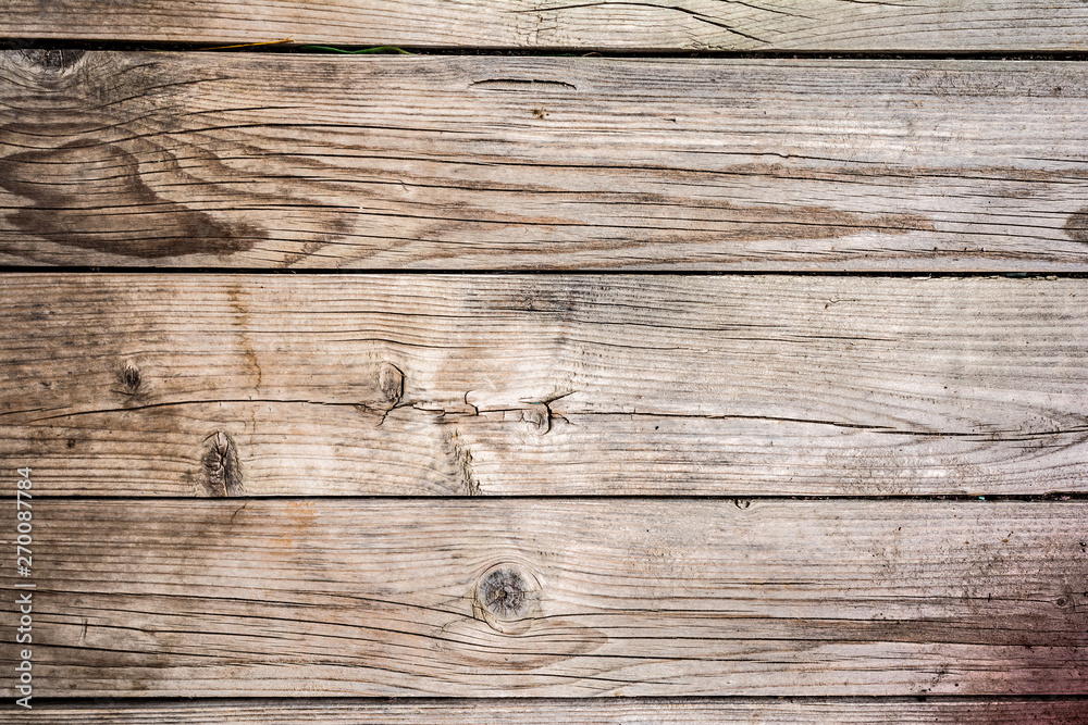 Fototapeta premium texture of old faded cracked wood, worn wood panel, close up abstraction background