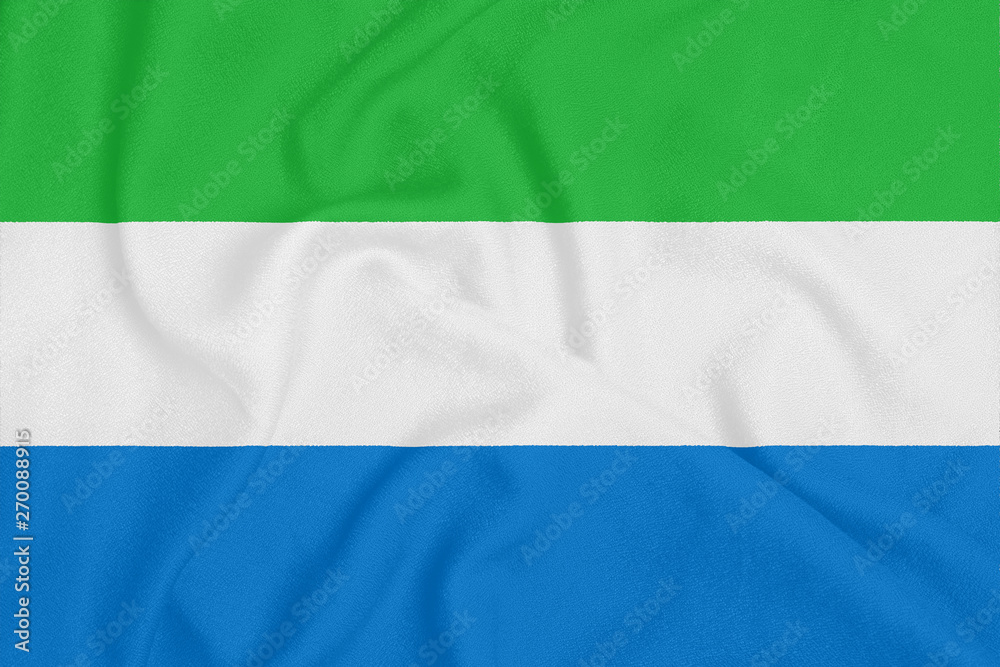 Obraz premium Flag of Sierra Leone on textured fabric. Patriotic symbol