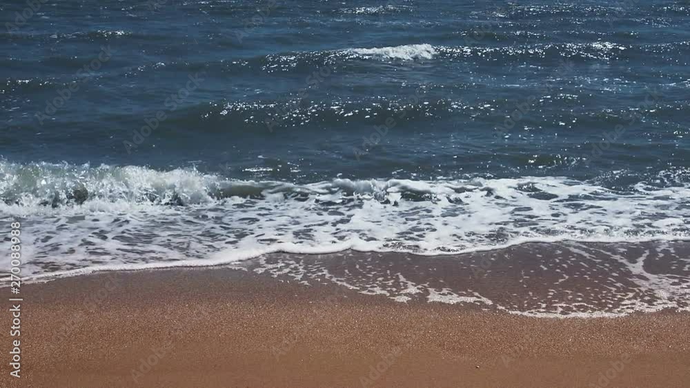 Slow motion waves crashing on the beach