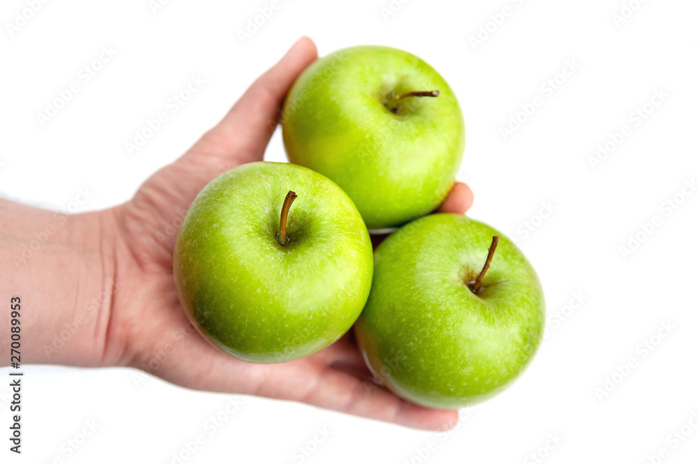 three ripe green apples in hand on white background three ripe green apples in hand on white background