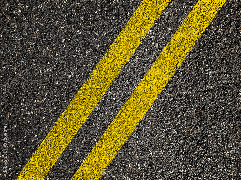 Fototapeta premium Asphalt road with double yellow lines.