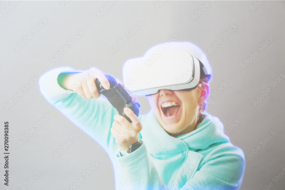 Woman with virtual reality headset is playing game. Image with hologram effect. Woman with virtual reality headset is playing game. Image with hologram effect.