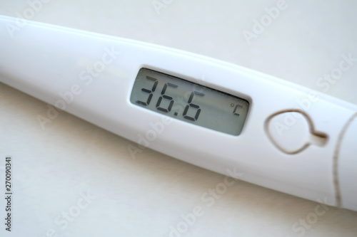 electronic digital thermometer to measure the body temperature of patients in the hospital, thirty-six and six degrees Celsius on the screen