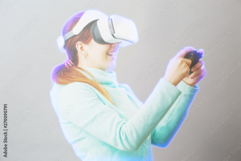 Woman with virtual reality headset is playing game. Image with hologram effect. Woman with virtual reality headset is playing game. Image with hologram effect.