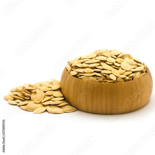 pile of Dried Pumpkin Seeds in Wooden Bowl – Healthy Snack Food on White Background