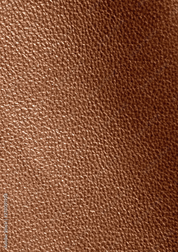 Texture of genuine leather. Brown background. The structure of the leather material close-up. Texture of genuine leather. Brown background. The structure of the leather material close-up.