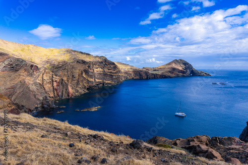 View of the bay and yacht at between cliffs at Ponta de Sao Lourenco, Madeira