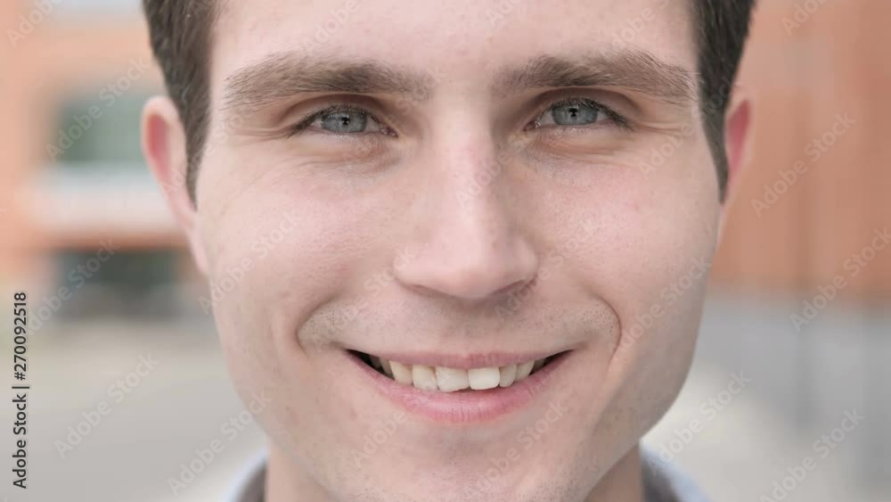 Outdoor Close up of Smiling Young Man Outdoor Close up of Smiling Young Man