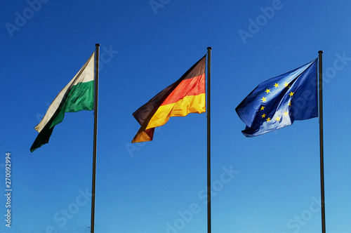 Three flags blowing in the wind