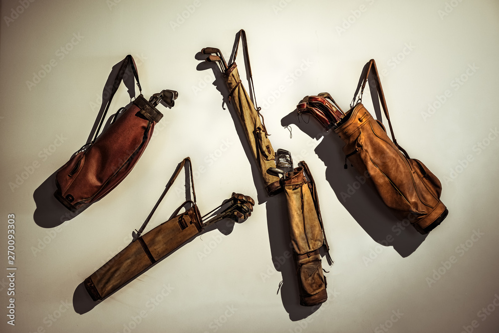 Set of old vintage golf clubs in bag hanging on the wall Stock Photo |  Adobe Stock