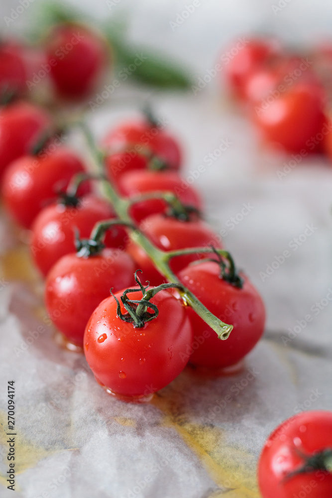 Fresh red tomatoes on a branch of with basil. Fresh red tomatoes on a branch of with basil.