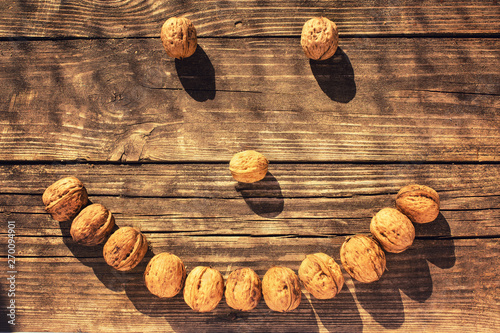 nuts smiley on wooden background