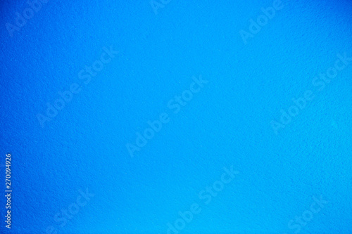 Monotonous fully blurred bright light blue background