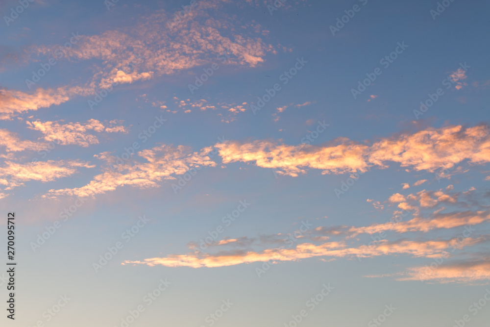 Sunset sky with small clouds colorful background