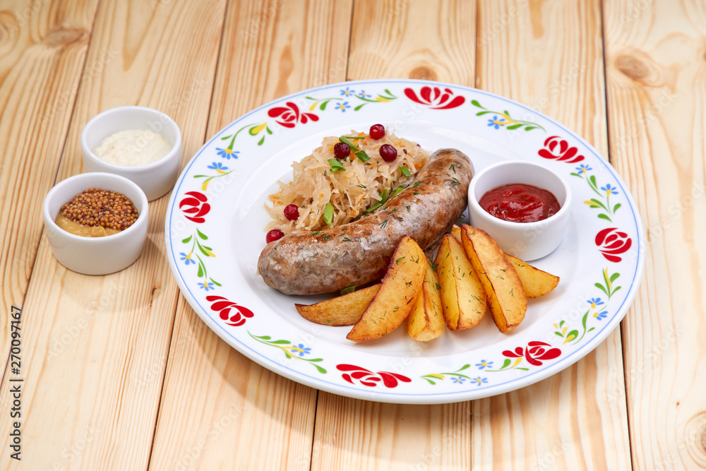 sausage with baked potatoes and sauce sausage with baked potatoes and sauce