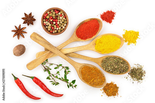 mix of spices in wooden spoon isolated on a white background. Top view. Flat lay. Set or collection