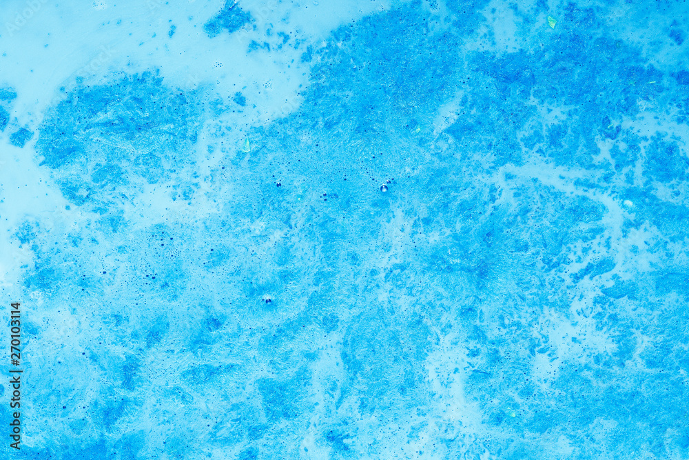 Abstract art texture background. Bubbling mixture design. Beautiful shiny sky blue paint with marbled effect.