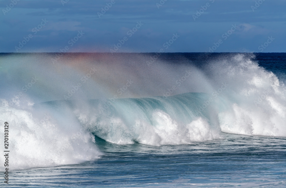Fototapeta premium Beautiful Breaking Wave with rainbow colors in Hawaii