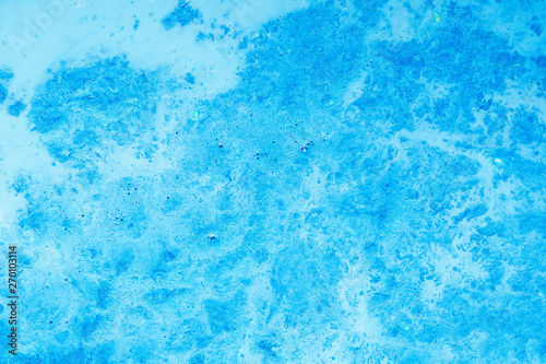 Abstract art texture background. Bubbling mixture design. Beautiful shiny sky blue paint with marbled effect.