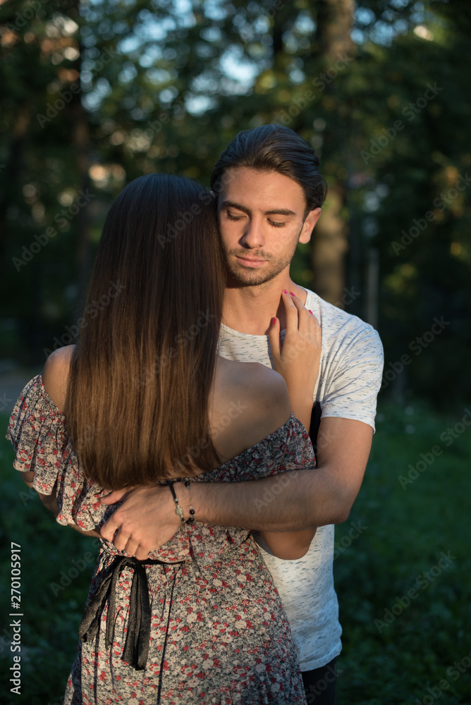young man hugging woman young man hugging woman