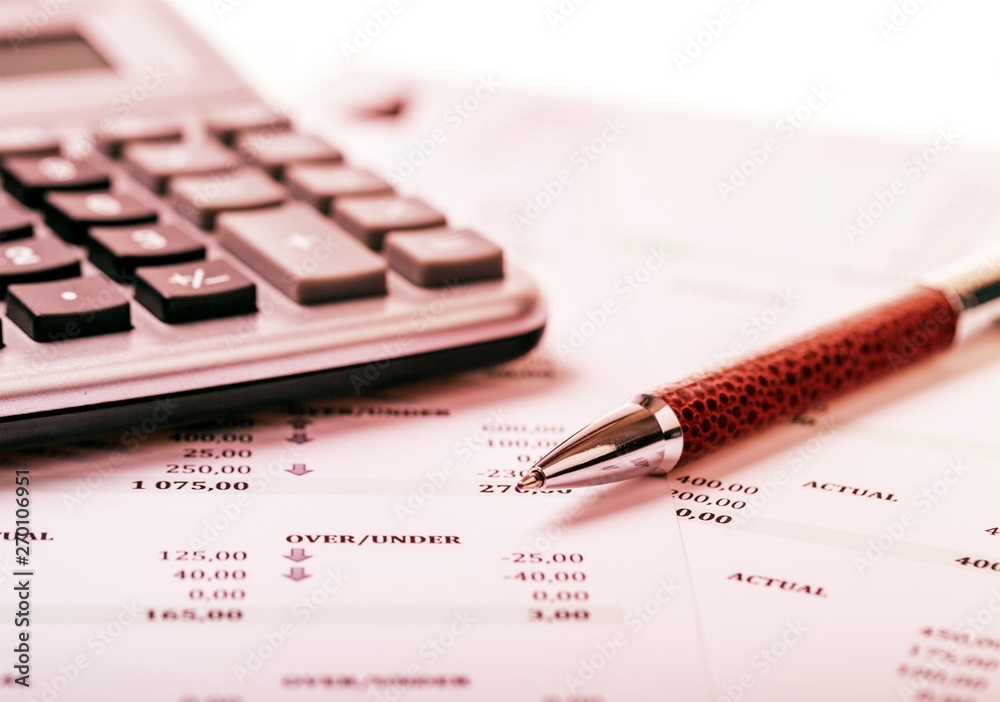 Calculator, pan and the financial report. Close up Calculator, pan and the financial report. Close up
