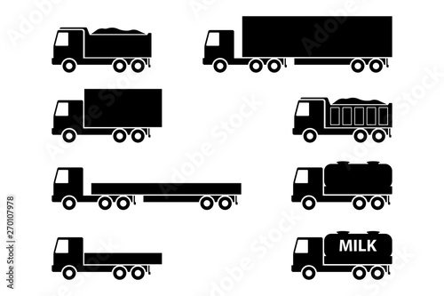 A set of trucks. Black silhouettes of industrial vehicles. Vector drawing. Isolated objects on white background. Isolate.
