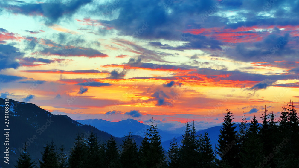 very colorful sunset in the mountains. amazing nature and landscapes.
