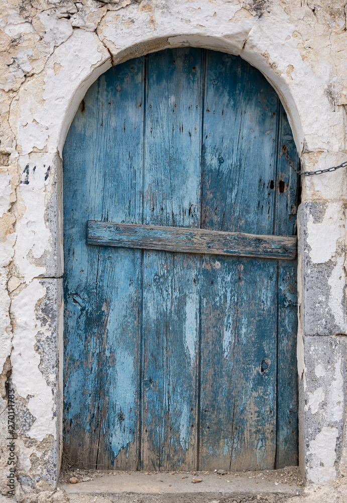 Old blue wooden door in Crete