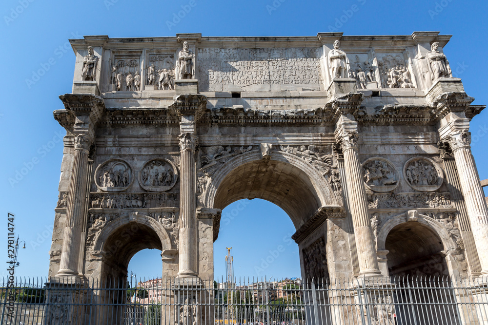 Ancient Arch of Constantine near Colosseum in city of Rome, Italy