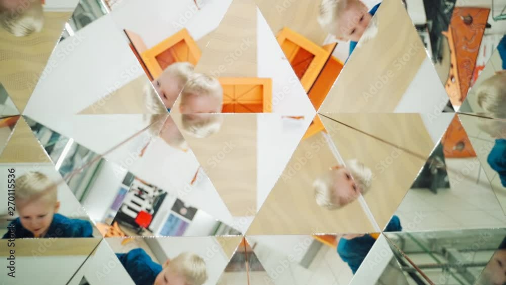 Child in a kaleidoscope tunnel. Glance into infinity