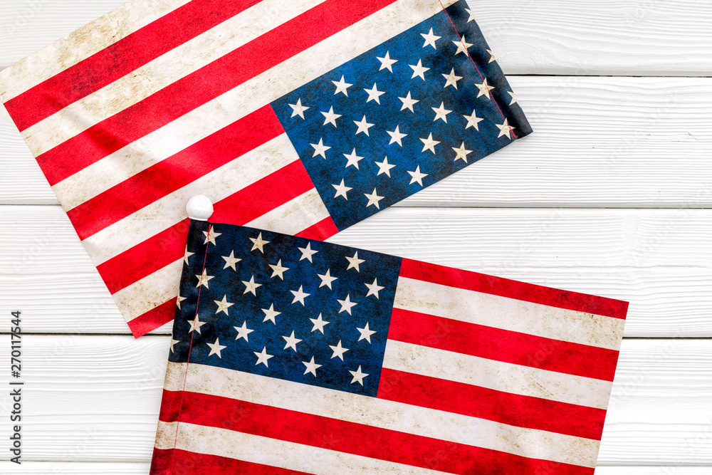 Fototapeta premium Independence day of USA with flag on white wooden background top view
