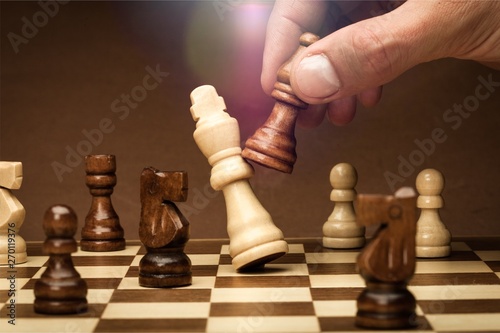 Businessman playing chess close up