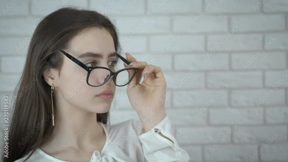 Portrait of a beautiful girl with glasses. Smart girl in eyeglasses. Portrait of a beautiful girl with glasses. Smart girl in eyeglasses.