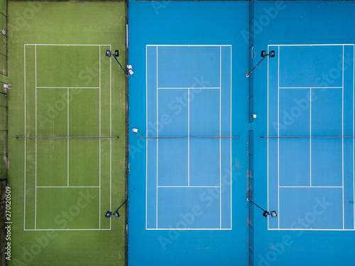 Aerial shot of three tennis courts side by side