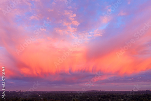 Clouds on fire with color in morning sunrise © Andrew Atkinson