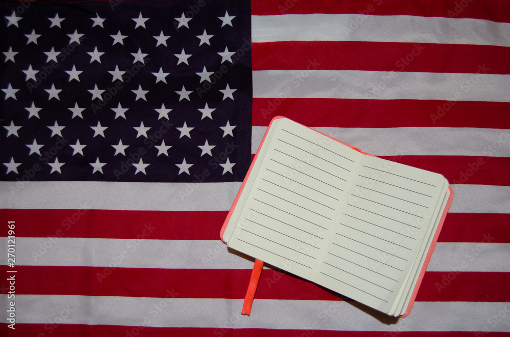 Fototapeta premium Usa flag with notebook, diary , copy space