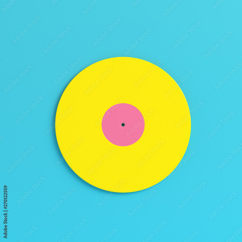Yellow vinyl record on bright blue background in pastel colors. Minimalism concept Yellow vinyl record on bright blue background in pastel colors. Minimalism concept