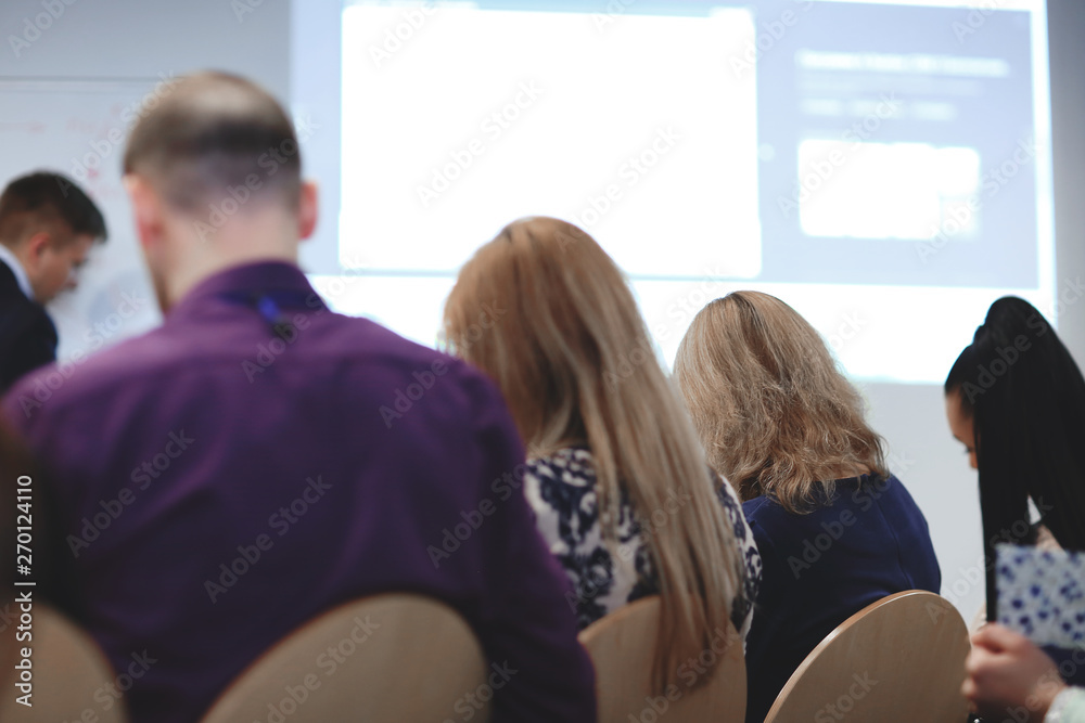 Fototapeta premium rear view.business team listening to the speaker