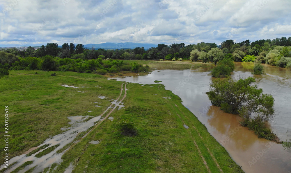 Flooding rivers flooding meadows a cloudy sky Flooding rivers flooding meadows a cloudy sky