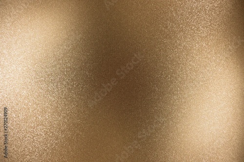Brushed bronze metallic foil surface, abstract texture background