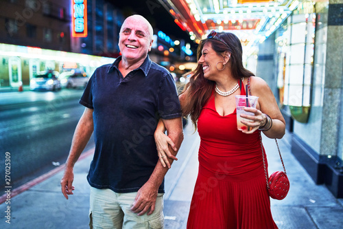 mature couple sightseeing in downtown las vegas streets photo