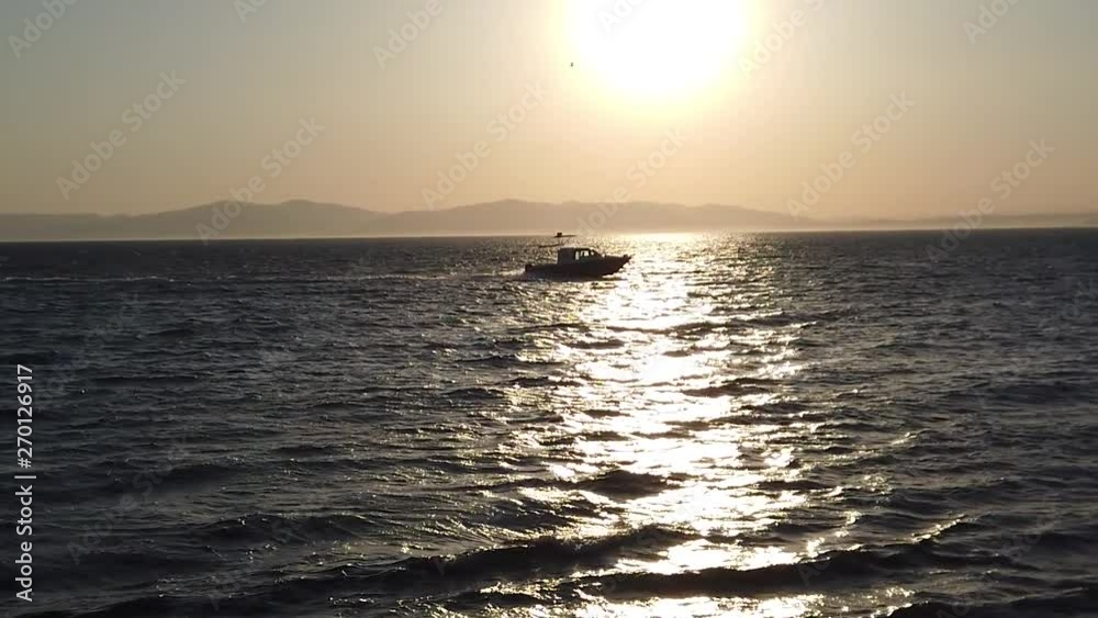 Slow motion sea scenery with a boat moving on the sea. Vladivostok, Russia